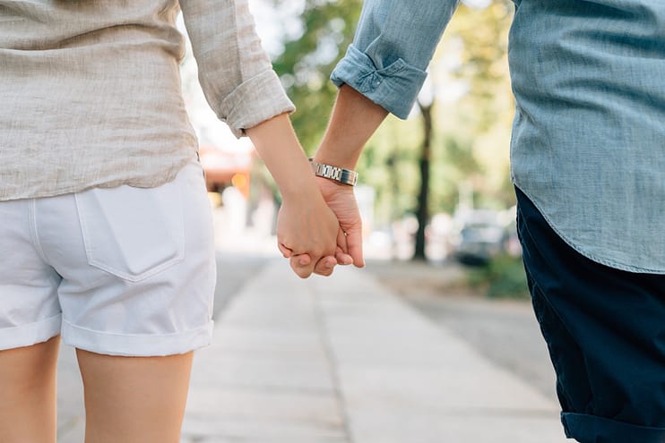 Couple in a relationship holding hands