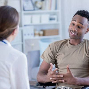 A female counsellor listening and giving counsel to a man about mental health
